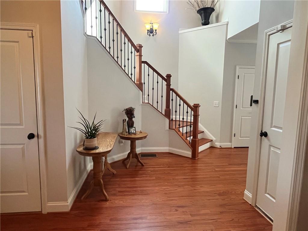 307 Cornerstone Trace Woodstock, GA 30188 - Photo 6 of 43 a view of entryway with wooden floor and stairs