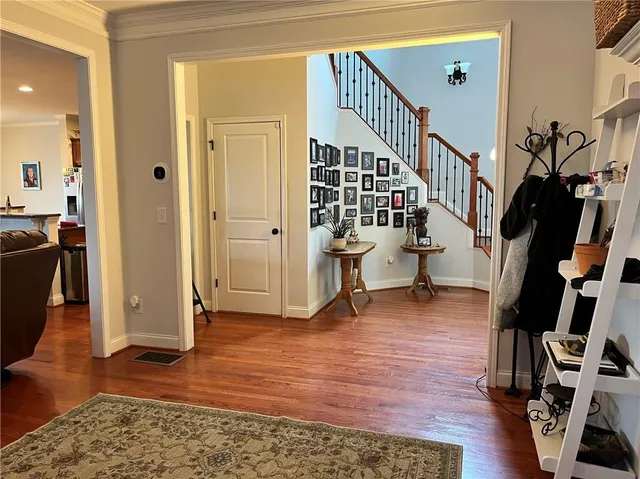 a kitchen with kitchen island granite countertop wooden cabinets and a stove