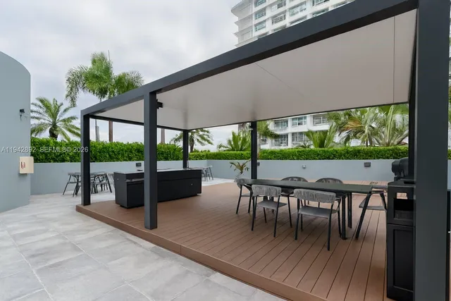 a view of a terrace with chairs and potted plants