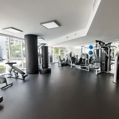a view of a kitchen with wooden floor