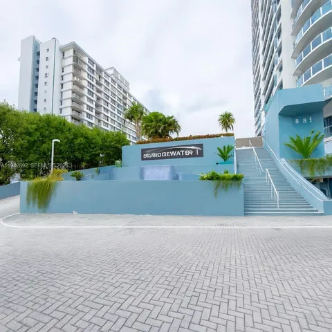 a view of a swimming pool with a yard