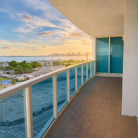 a view of a bathroom with a shower and a sink