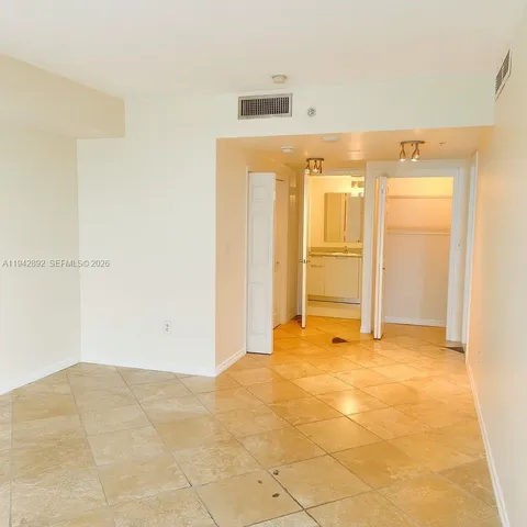 a bathroom with a granite countertop sink a toilet and a mirror