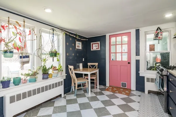 a view of a dining room with furniture window and outside view