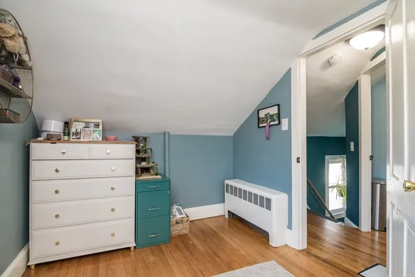 a view of a hallway with closet and cabinet