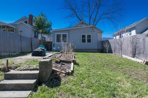 a backyard of a house with seating space