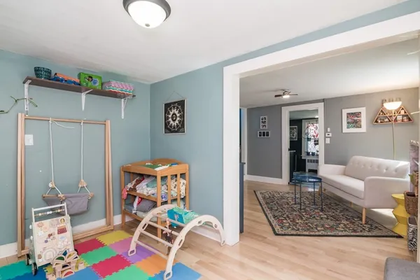 a living room with furniture and a rug