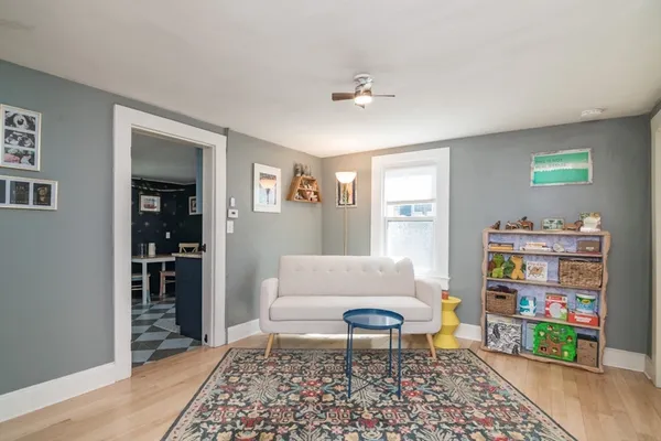 a living room with furniture and a rug