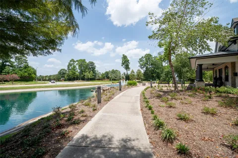 a park view with a bench in the patio