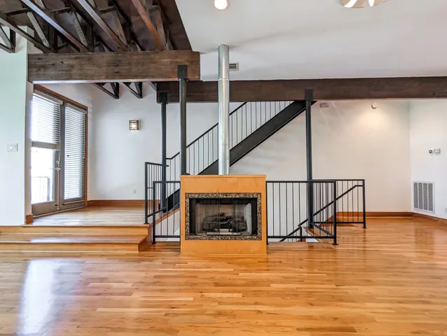 a view of entryway wooden floor and front door