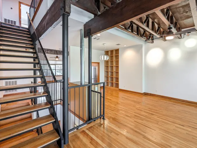 a view of an entryway with wooden floor