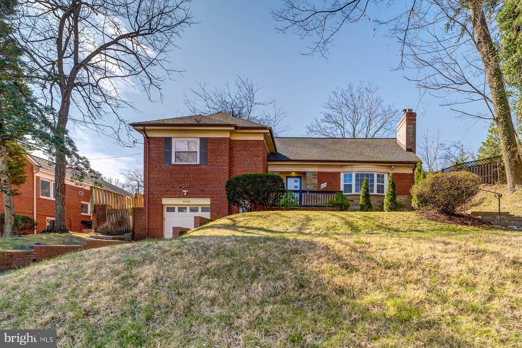 2608 Rittenhouse Street Northwest Washington, DC 20015 - Photo 2 of 45 a front view of a house with a yard