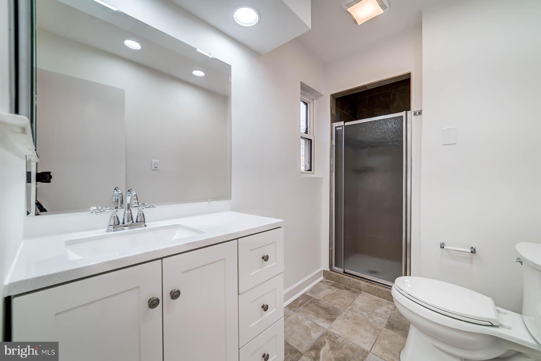 2608 Rittenhouse Street Northwest Washington, DC 20015 - Photo 25 of 45 a bathroom with a sink toilet and shower