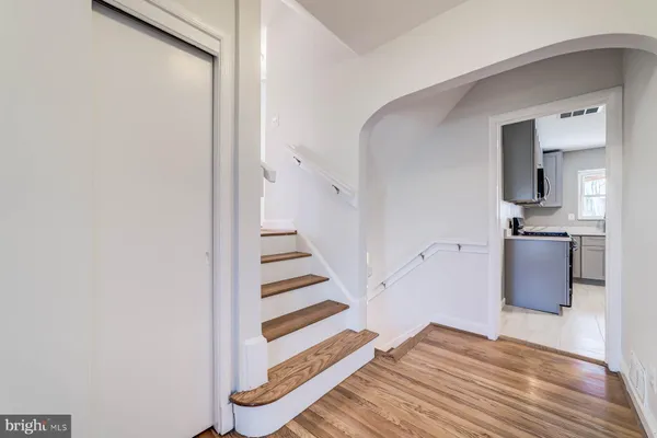 a view of kitchen and wooden floor