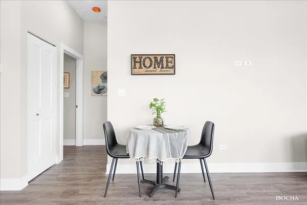 a view of a livingroom with furniture and wooden floor