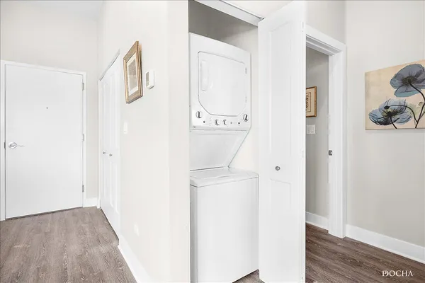 a view of a storage & utility room with wooden floor
