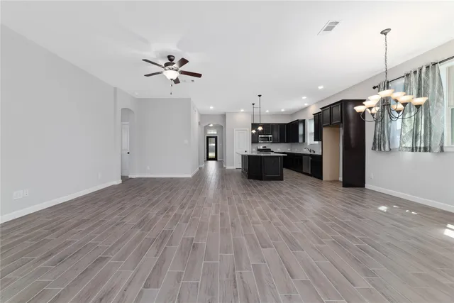 a front view of house with a garden