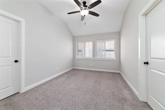 a view of a kitchen with a sink and a refrigerator