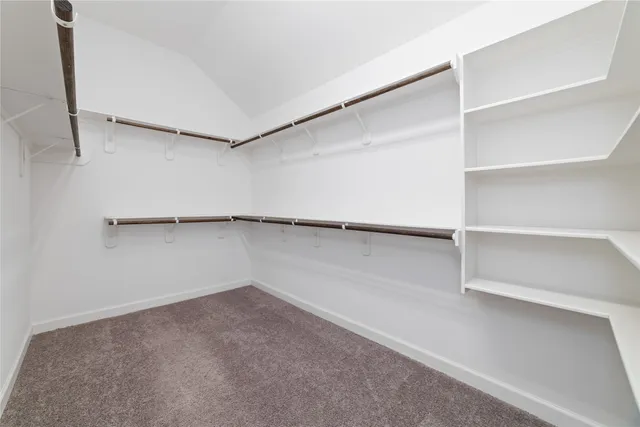 a bathroom with a granite countertop bathtub a sink and mirror