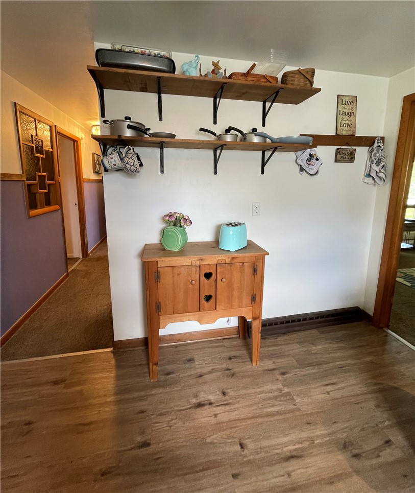 360 Ridge Street Piqua, OH 45356 - Photo 10 of 46 This inviting area features practical shelving, providing both storage and display opportunities within a warm space.