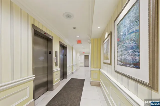 a bathroom with a glass shower door and a bathtub