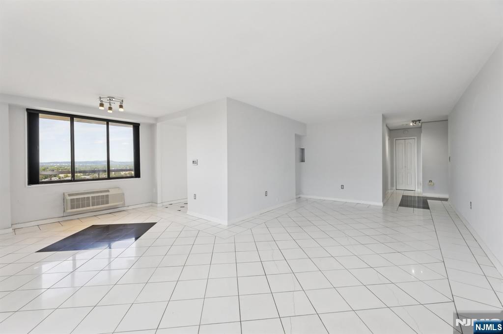 151 Prospect Avenue, Unit 18A Hackensack, NJ 07601 - Photo 6 of 19 a view of an empty room with a window