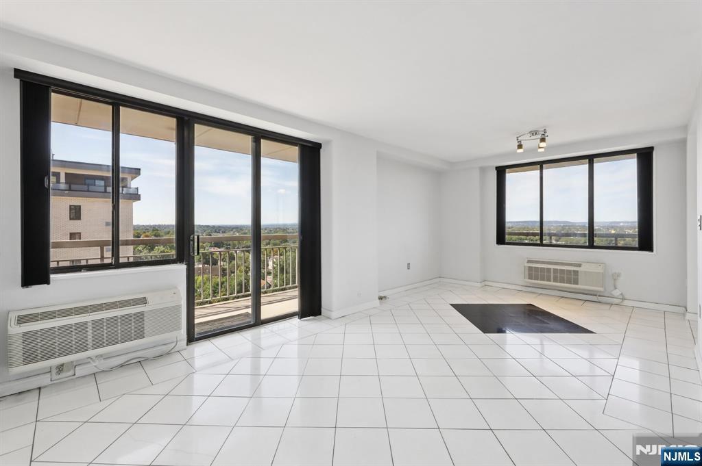 151 Prospect Avenue, Unit 18A Hackensack, NJ 07601 - Photo 7 of 19 a view of an empty room and window