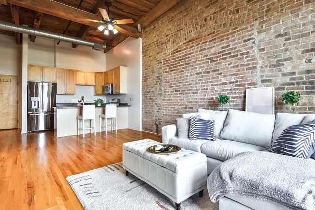 a living room with furniture and a table