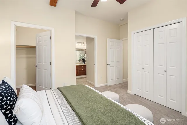 a bedroom with a bed and a shower