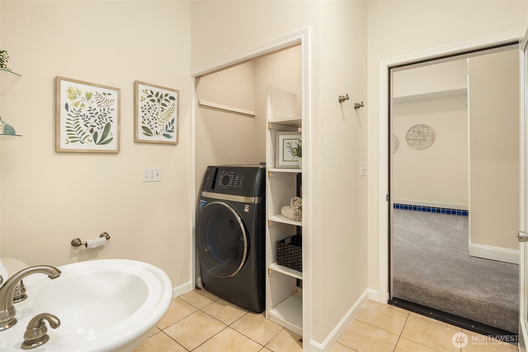 23723 9th Place West Bothell, WA 98021 - Photo 22 of 28 a bathroom with a sink and a washing machine