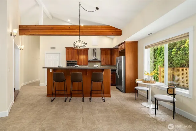 a dining room with furniture and a chandelier