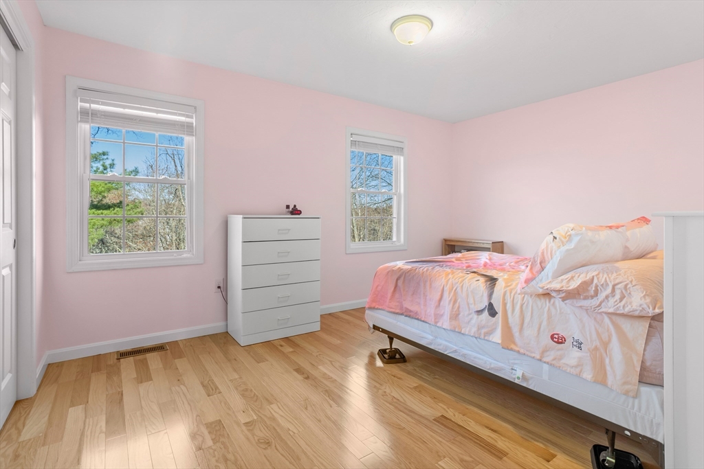 41 Boston Road, Unit 433 Billerica, MA 01862 - Photo 12 of 23 a bedroom with a bed and a window