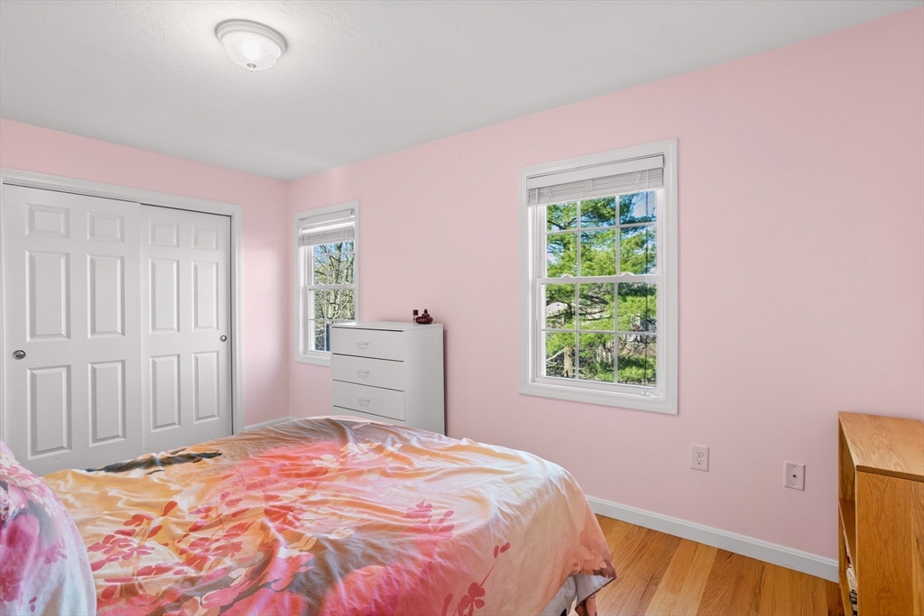 41 Boston Road, Unit 433 Billerica, MA 01862 - Photo 13 of 23 a bedroom with a bed and a window