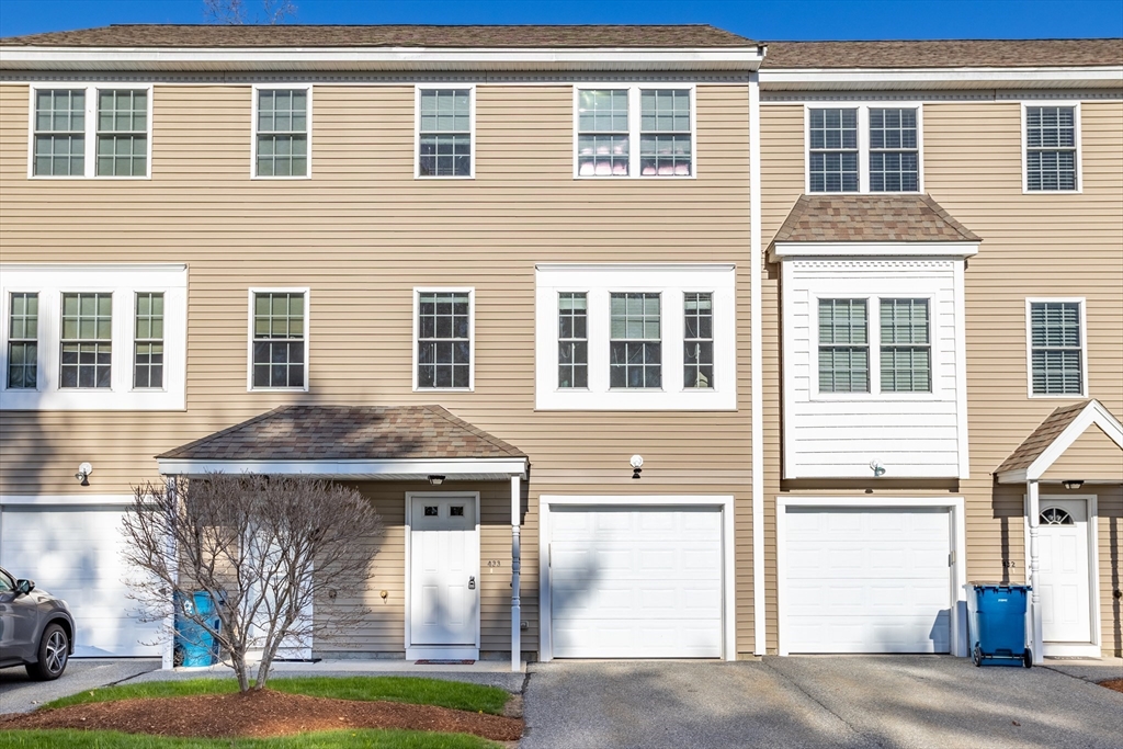 41 Boston Road, Unit 433 Billerica, MA 01862 - Photo 2 of 23 a front view of a house with a yard