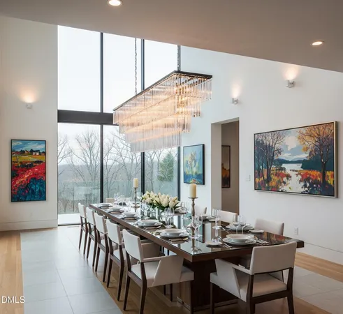 a view of a dining room with furniture large window and outside view