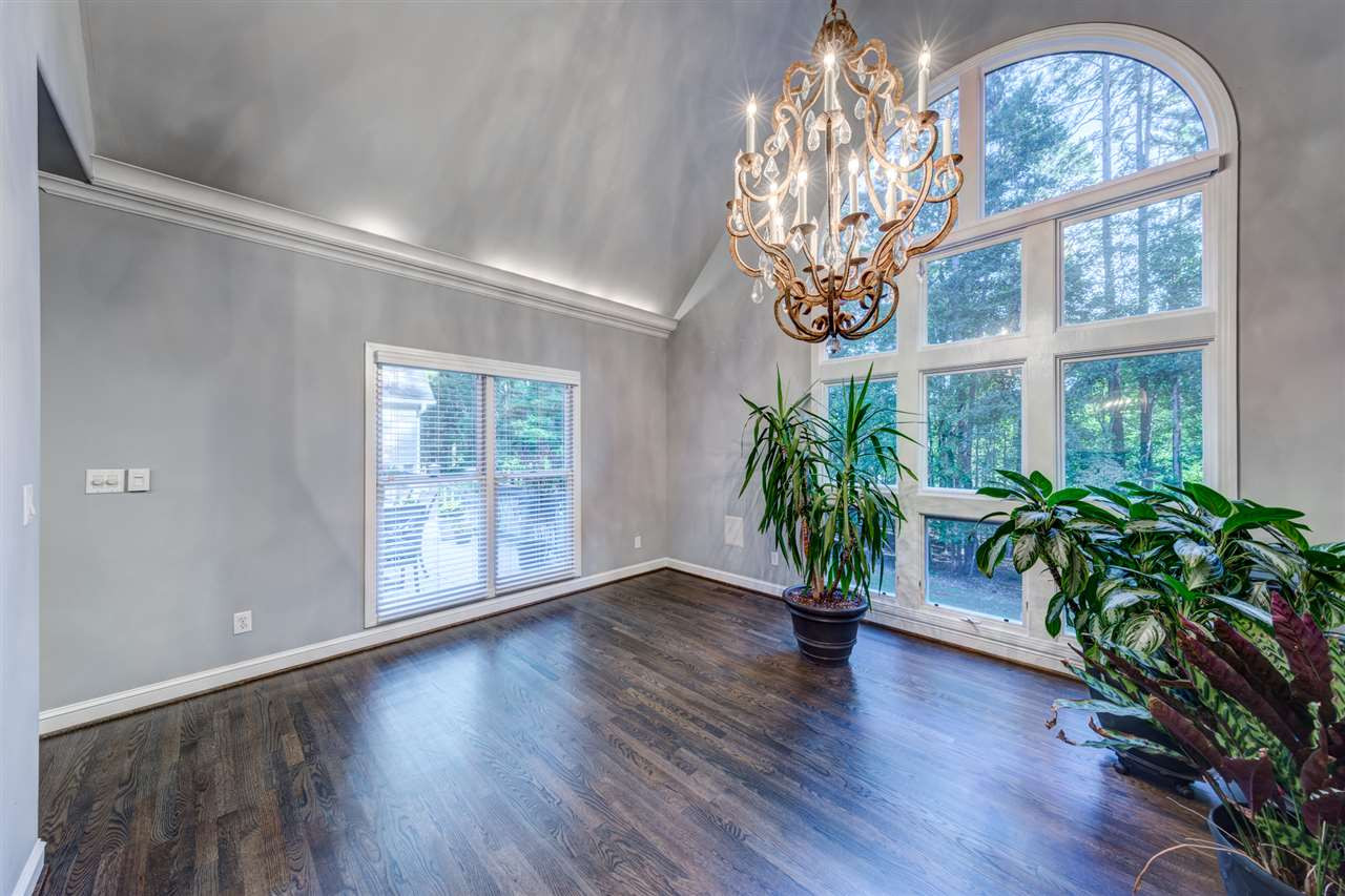 648 Pendleton Lake Road Raleigh, NC 27614 - Photo 10 of 30 Spacious formal Dining Room makes guests feel special during meals. Vaulted Ceiling, designer chandelier and views of the private backyard and lake. Formal Dining Room