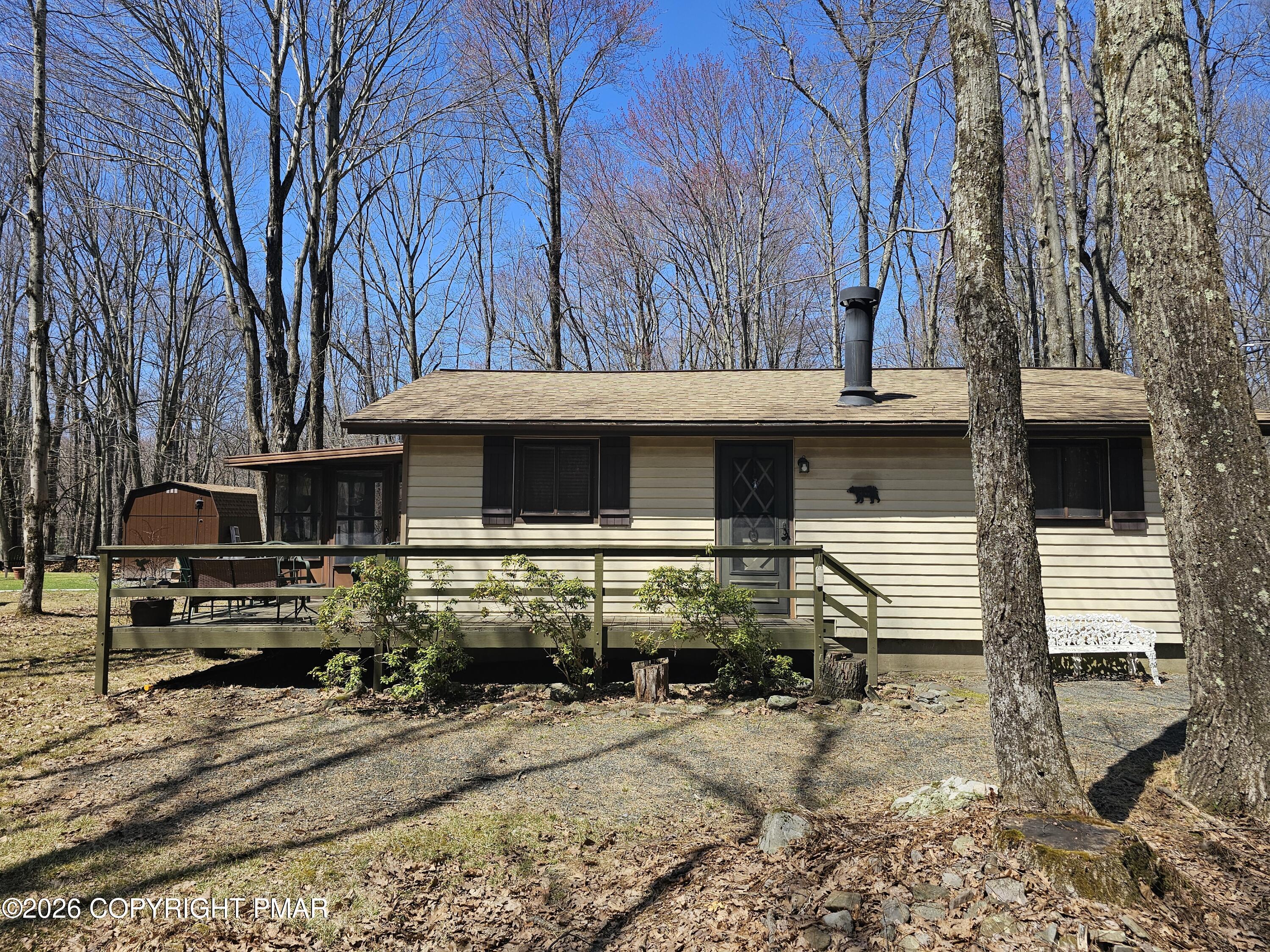 a view of house with backyard