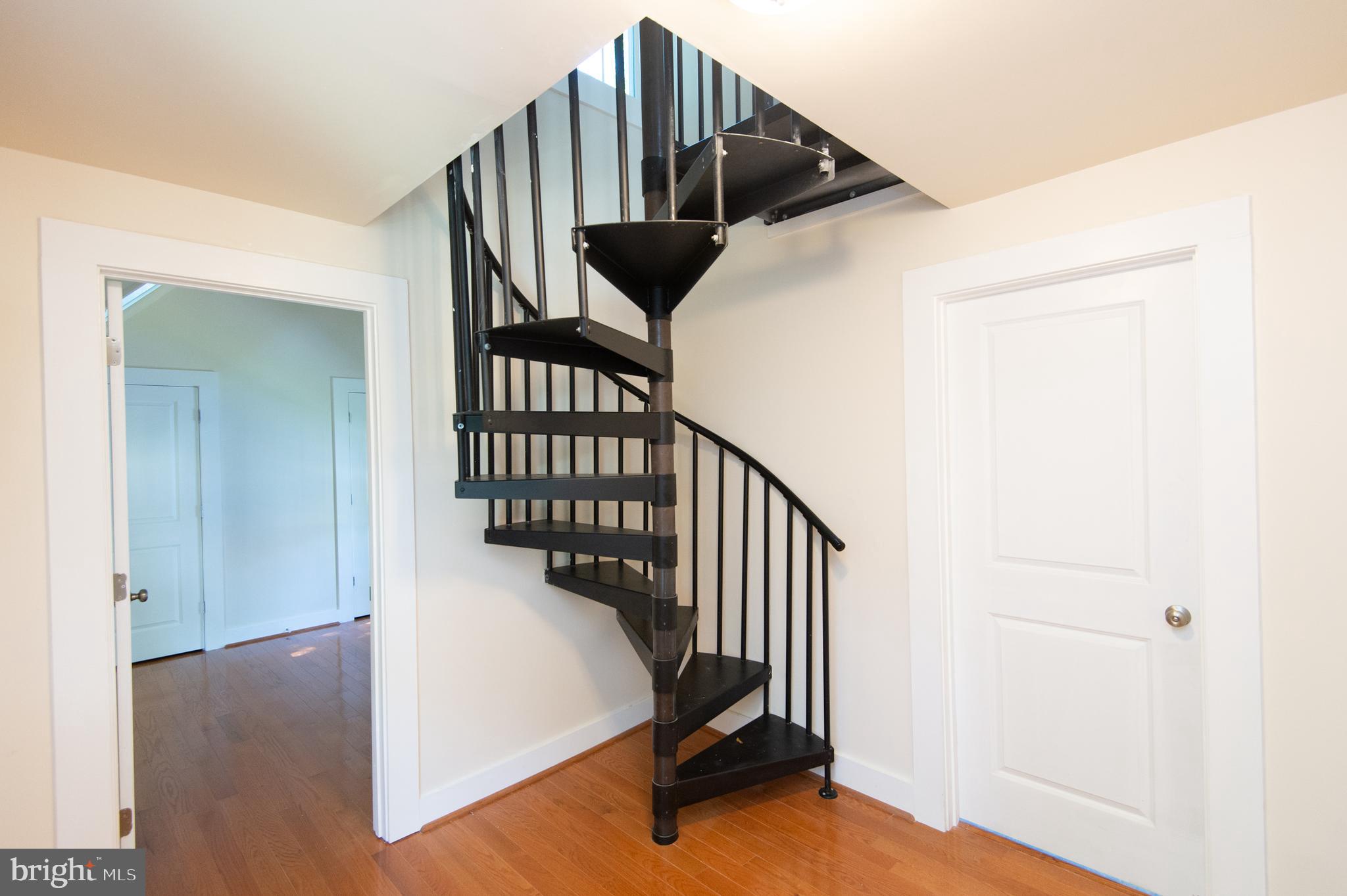 315 Willis Street Cambridge, MD 21613 - Photo 21 of 31 spiral stairs on 2nd floor leading to the 3rd flr