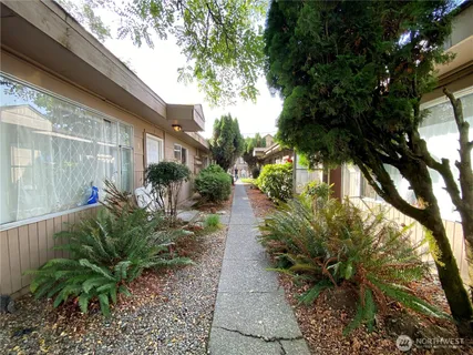 a backyard of a house with a garden
