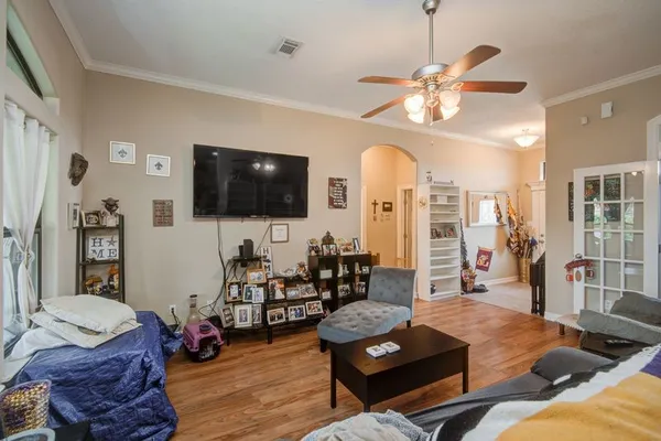 a living room with furniture and a flat screen tv