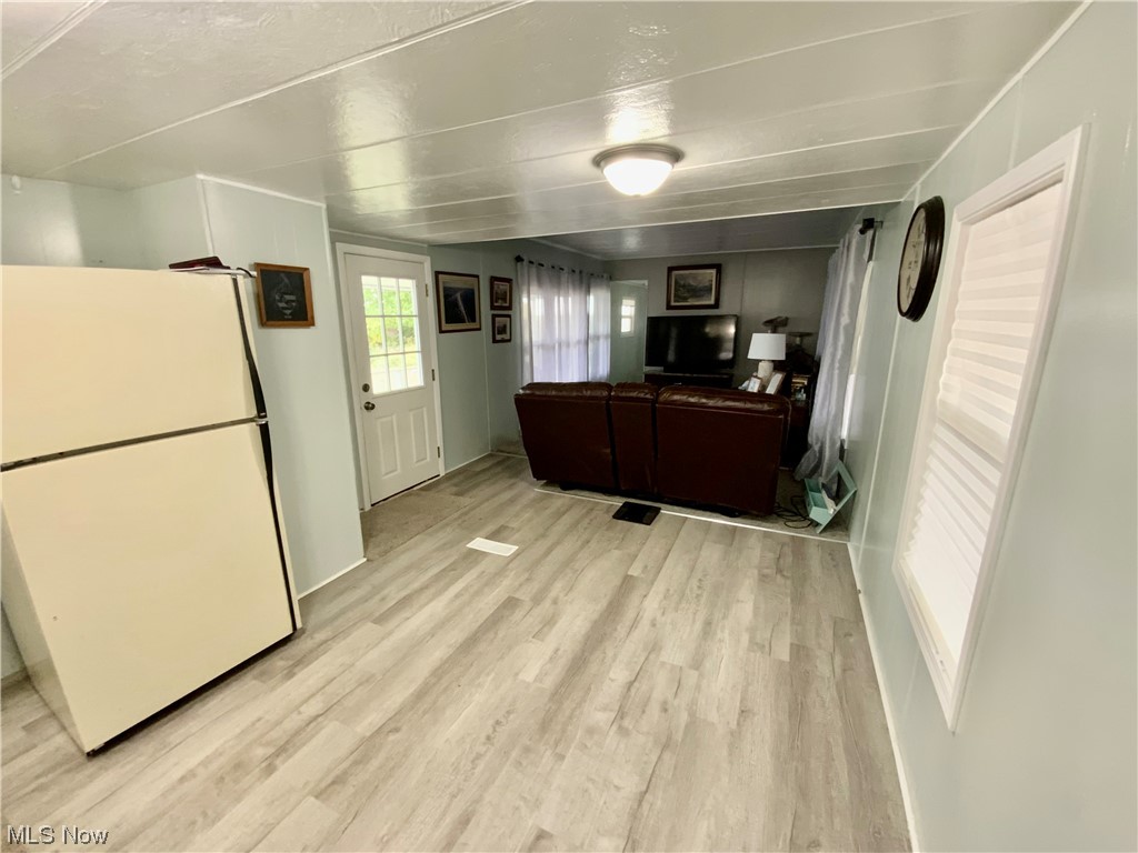 4199 Massillon Road, Unit 223 Uniontown, OH 44685 - Photo 6 of 20 Kitchen with white fridge and light hardwood flooring