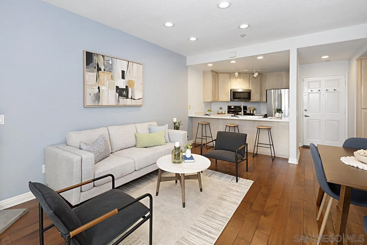 3620 Third Avenue, Unit 104 San Diego, CA 92103 - Photo 2 of 7 a living room with stainless steel appliances kitchen island a table and chair
