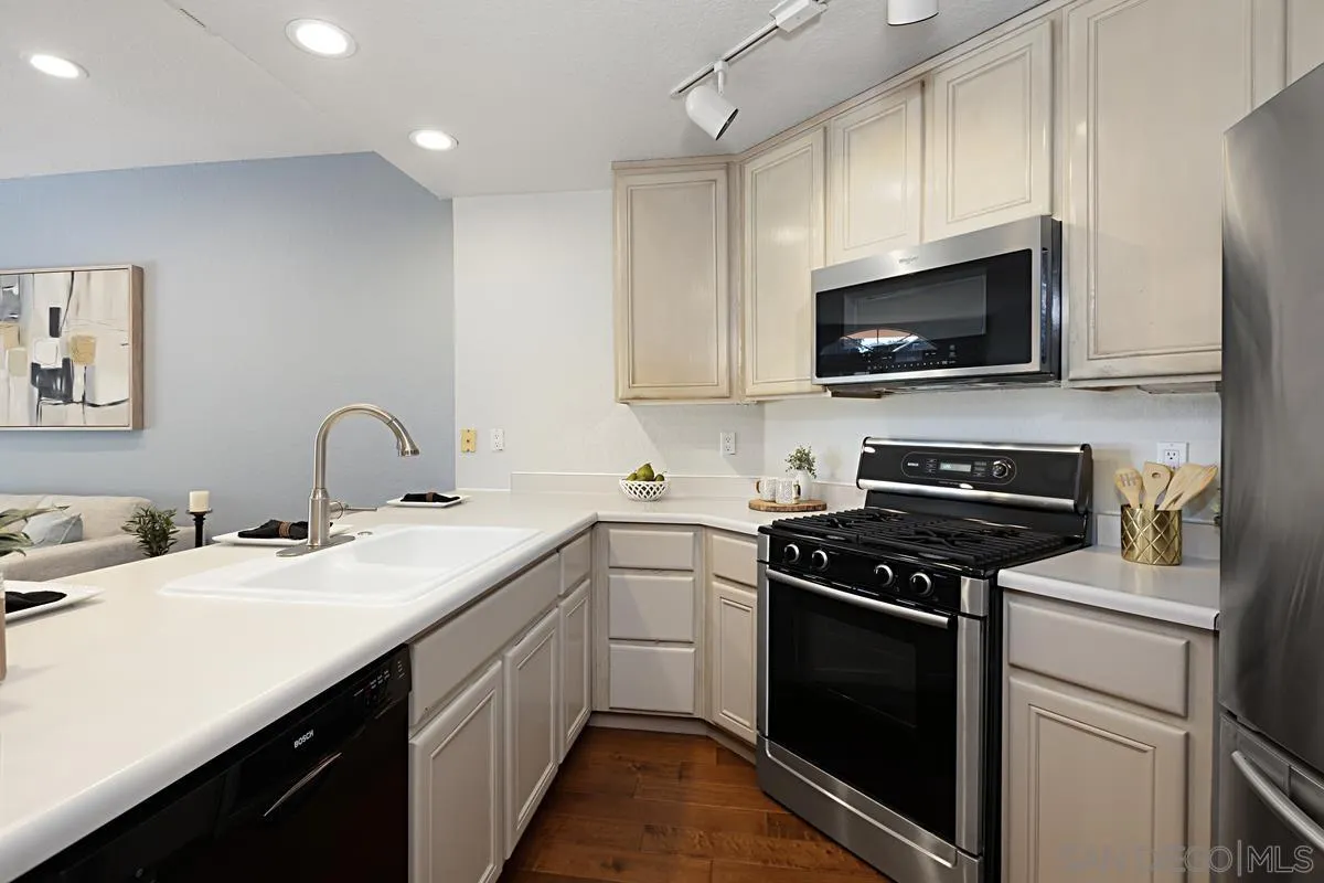 3620 Third Avenue, Unit 104 San Diego, CA 92103 - Photo 3 of 7 a kitchen with a sink stove and microwave