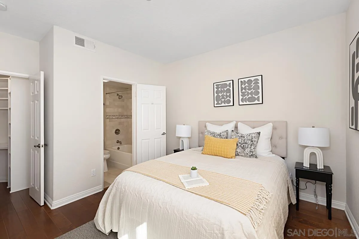 3620 Third Avenue, Unit 104 San Diego, CA 92103 - Photo 5 of 7 a bedroom with a bed and wooden floor