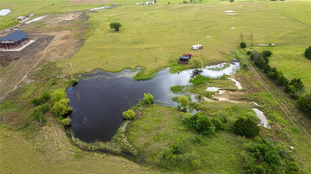 340 Stevens Road Ennis, TX 75119 - Photo 4 of 18 a view of a lake with a houses