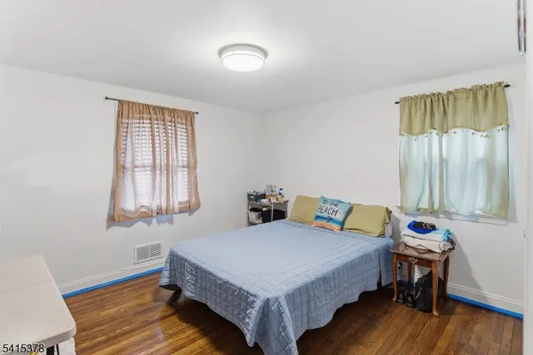 a bathroom with a toilet and a shower curtain