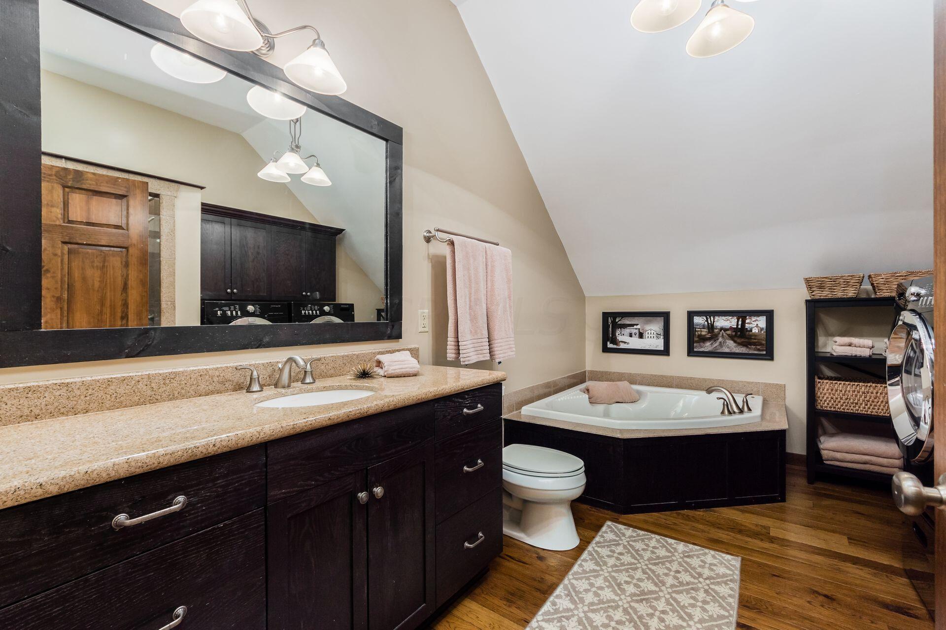 11444 Hazel Dell Road Howard, OH 43028 - Photo 32 of 41 The second-floor full bath with soak tub, shower and laundry.