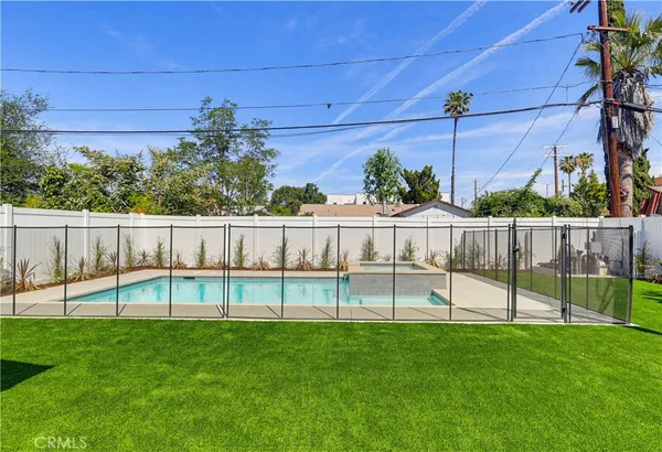 a view of a swimming pool with a patio