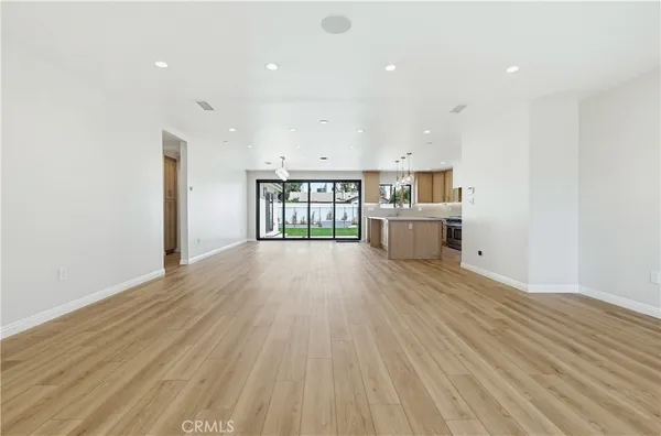 a view of kitchen and wooden floor