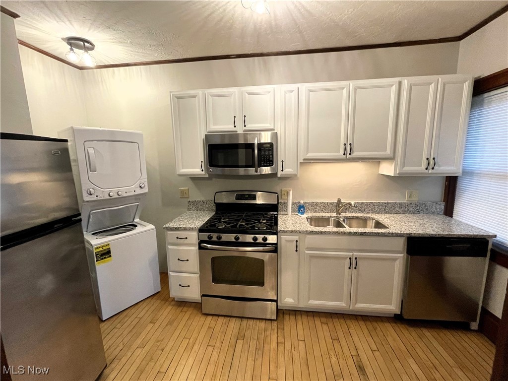 1905 Fulton Road, Unit 1B Cleveland, OH 44113 - Photo 7 of 22 Fully-equipped kitchen with recent stainless appliances plus stacking washer/dryer